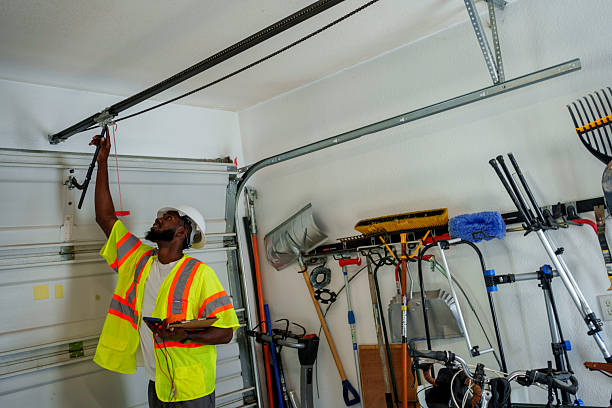 Professional Garage Door Panel Replacement technician working in Elkins, AR